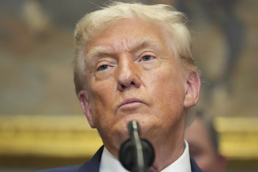 President Donald Trump listens during an event to sign an executive order restarting the Presidential Fitness Test in public schools, July 31, 2025, in the Roosevelt Room of the White House in Washington
