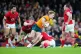 Australia's Tate McDermott (centre right) runs with the ball