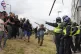 RAGE: Locals confront police 
guarding the Holiday Inn 
Expr
