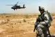 A US soldier stands guard as a helicopter takes off during t