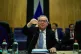 Jean-Claude Juncker rings a bell during a weekly College of 
