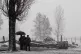 People shelter from the snow at Birkenau ahead of a memorial