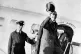 Neville Chamberlain waves his hat as he boards an aircraft b