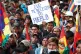 OUSTED: A man holds a sign that reads in Spanish: ‘Evo [Mo