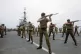 Royal Marines exercise the deck of the HMS Hermes, the Flag 