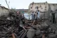 Afghans stand among destruction after the 5.9 magnitude eart