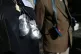 POIGNANT: Protesters wear baby shoes, to signify the childre