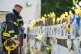 POIGNANT: A firefighter views tributes at Latymer Community 