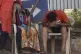 AGONY: Relatives of a person who died of Covid-19 mourn outs