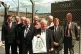 VINDICATED: Mike Grindley (centre) holds up his famous
bag 