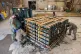 STOKING CONFLICT: US soldiers load pallets of weapons and ex