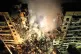 Emergency workers clear the rubble after a Russian rocket hi