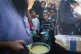 FACING STARVATION: Palestinians queue for food in Deir al-Ba