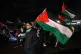 Celtic fans wave the Palestinian and Scottish flags