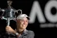 Caroline Wozniacki lifts the women's Australian Open trophy 