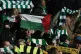 A Celtic fan waves the Palestinian flag