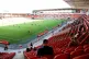 Socially distanced Blackpool fans watch from the stands duri