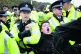 An XR activist is carried away by the police