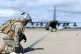 A US airman secures a fuel line on the flightline at Royal A