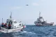 An Italian coastguard vessel (left) picks up some of the ref