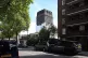 A partially covered-up Grenfell Tower is seen from a nearby residential street in west London.