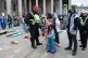 Palestine and climate activists protest outside the British 