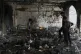 Palestinians inspect the damage after an Israeli army airstrike on Yaffa School, in Gaza City, Wednesday, April 23, 2025