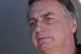 Former Brazilian President Jair Bolsonaro talks with supporters during his arrival to the international airport in Brasilia, Brazil, July 5, 2024