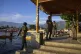 Paramilitary soldiers stand guard at the banks of Dal Lake as Indian tourists take boat rides in Srinagar, Indian controlled Kashmir, April 25, 2025