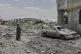 A Yemeni soldier inspects the damage reportedly caused by US air strikes in Sanaa, Yemen, April 27, 2025