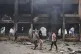 Palestinians inspect the damage after an Israeli army airstrike on Yaffa School, in Gaza City, April 23, 2025