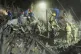 Ukrainian searchers clear the rubble after a Russian ballistic missile attack in Kyiv, Ukraine, April 24, 2025