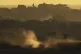 An Israeli army tank maneuvers in the Gaza Strip is seen from southern Israel, May 4, 2025