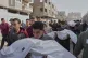 Palestinians carry the bodies of those who were killed by an overnight Israeli air strike, during their funeral in Khan Younis, Gaza Strip, May 11, 2025