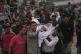 Mourners carry the body of a Palestinian for burial after the person was killed in an Israeli military airstrike that hit a U.N. school, in Jabaliya, northern Gaza Strip, on Monday, May 12, 2025