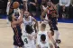New York Knicks' Jalen Brunson (left) shoots over Boston Celtics' Jrue Holiday (4) and Derrick White (9) during the first half of Game 4 in the Eastern Conference semifinals of the NBA basketball playoffs, May 12, 2025, in New York