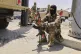 A Libyan soldier takes a rest near a checkpoint in Tripoli, Libya, Tuesday, May 13, 2025
