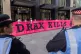 Activists hold a banner as they blockade the entrance