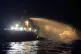 A firefighting-equipped tug boat (left) contacted by the Malta Vessel Traffic Services (VTS) helps controlling a fire occurred on the bow of the Conscience vessel in international waters of the Mediterranean Sea, May 2, 2025. Photo: Malta Vessel Traffic Services via AP