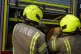 Firefighter officers running through a practice drill during a London Fire Brigade facility at Poplar Fire Station in London