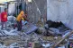 Palestinians children inspect the damage caused by an Israeli air strike that targeted displacement tents in Deir al-Balah, in the central Gaza Strip, May 7, 2025
