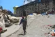 A man and his son traverse a road in the Kenscoff neighborhood, which has seen residents evacuating due to gang violence, in Port-au-Prince, Haiti, April 21, 2025