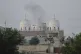 Local residents stand outside a mosque of an Islamic seminary partially damaged by a suspected Indian missile attack, outskirts of Bahawalpur, Pakistan, May 7, 2025