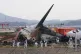 Rescue team members work at the site of a plane crash at Muan International Airport in Muan, South Korea on December 31, 2024