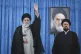 Supreme Leader Ayatollah Ali Khamenei waves to the crowd as he arrives for a ceremony marking the anniversary of the 1989 death of the late revolutionary founder Ayatollah Khomeini, shown in the poster in background, as Ayatollah Khomeini's grandson Hassan stands at right, at his shrine just outside Tehran, Iran, June 4, 2025