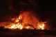 Flames rise from an oil storage facility after it appeared to have been hit by an Israeli strike in Tehran, Iran, June 15, 2025