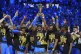 Oklahoma City Thunder guard Shai Gilgeous-Alexander (centre), holds up the MVP trophy as he celebrates with his team after they won the NBA basketball championship with a Game 7 victory against the Indiana Pacers  June 22, 2025, in Oklahoma City