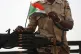 A Sudanese soldier from the Rapid Support Forces or RSF, stands on his vehicle during a military-backed tribe's rally, in the East Nile province, Sudan, June 22, 2019