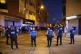 Local police officers and Spanish civil guard agents take positions during the disturbances in Torre Pacheco, eastern Spain, Friday, July 12, 2025
