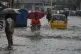 Motorists drive through a flooded road during monsoon rainfall, in Rawalpindi, Pakistan, Thursday, July 17, 2025